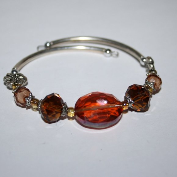 Stunning silver and orange crystal coil bracelet